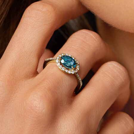 Halo Ring with London Blue Topaz & 0.25 Carat TW of Diamonds in 10kt Yellow Gold Halo Ring with London Blue Topaz & 0.25 Carat TW of Diamonds in 10kt Yellow Gold