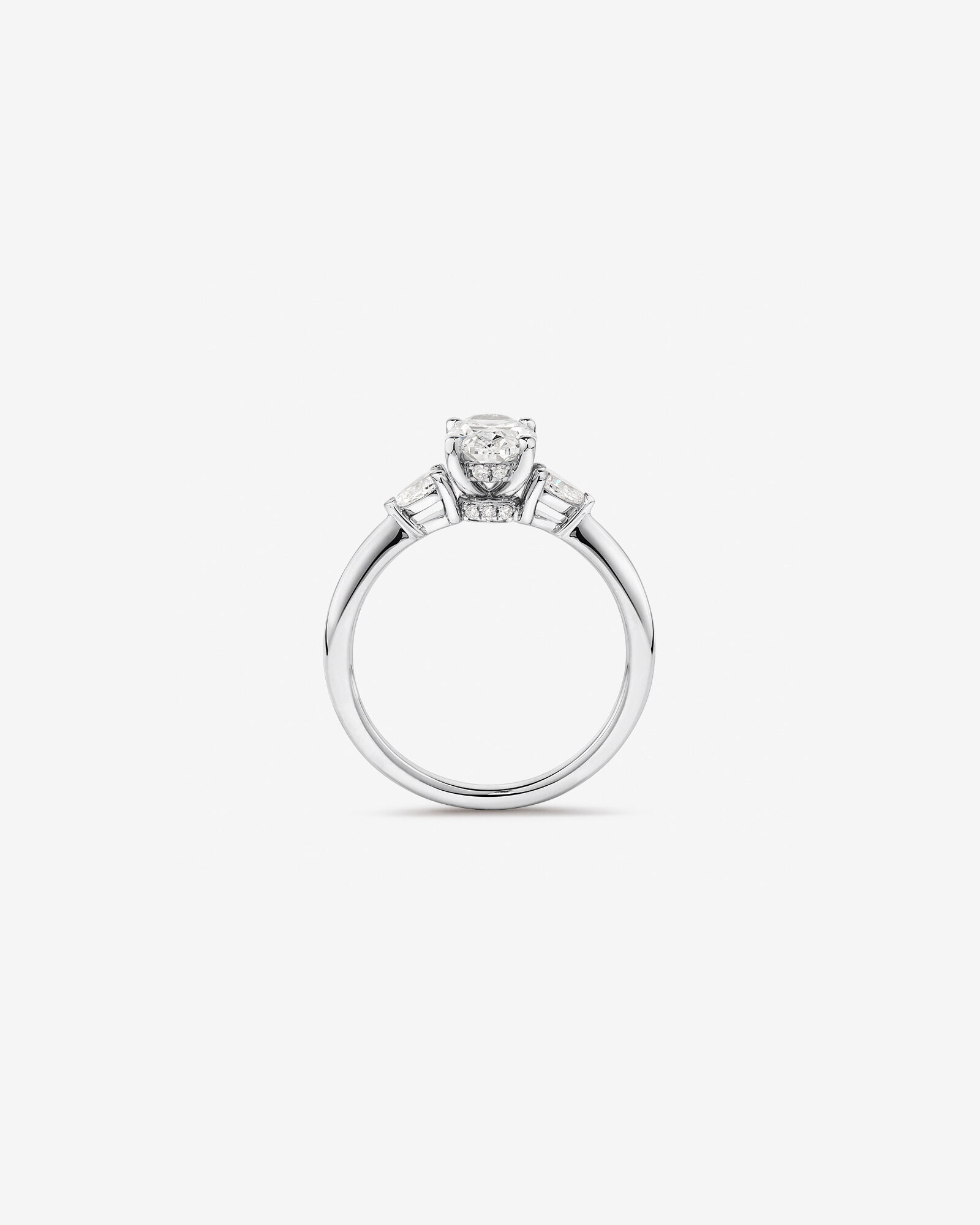 1.10 Carat TW Three Stone Oval and Pear Hidden Halo Engagement Ring in Platinum