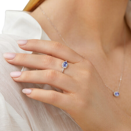 Halo Ring with Tanzanite & 0.15 Carat TW Of Diamonds in 10kt White Gold Halo Ring with Tanzanite & 0.15 Carat TW Of Diamonds in 10kt White Gold