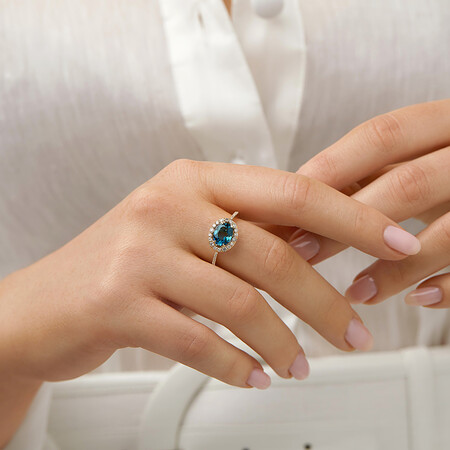 Halo Ring with London Blue Topaz & 0.25 Carat TW of Diamonds in 10kt Yellow Gold Halo Ring with London Blue Topaz & 0.25 Carat TW of Diamonds in 10kt Yellow Gold