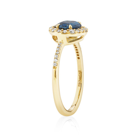 Halo Ring with London Blue Topaz & 0.25 Carat TW of Diamonds in 10kt Yellow Gold Halo Ring with London Blue Topaz & 0.25 Carat TW of Diamonds in 10kt Yellow Gold