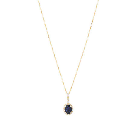 Oval Halo Pendant with Sapphire & 019 Carat TW of Diamonds in 14kt Yellow Gold