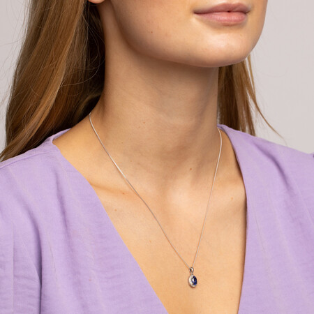 Halo Pendant with Created Blue Sapphire and 0.04 TW of Diamonds in Sterling Silver Halo Pendant with Created Blue Sapphire and 0.04 TW of Diamonds in Sterling Silver