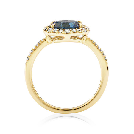Halo Ring with London Blue Topaz & 0.25 Carat TW of Diamonds in 10kt Yellow Gold Halo Ring with London Blue Topaz & 0.25 Carat TW of Diamonds in 10kt Yellow Gold