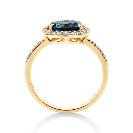 Halo Ring with London Blue Topaz & 0.25 Carat TW of Diamonds in 10kt Yellow Gold Halo Ring with London Blue Topaz & 0.25 Carat TW of Diamonds in 10kt Yellow Gold