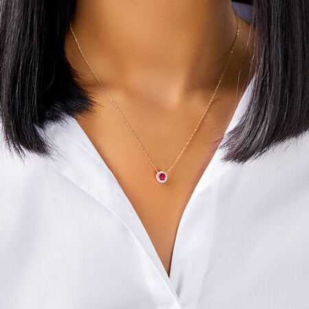 Halo Pendant with Ruby & 0.14 Carat TW of Diamonds in 10kt Yellow Gold Halo Pendant with Ruby & 0.14 Carat TW of Diamonds in 10kt Yellow Gold