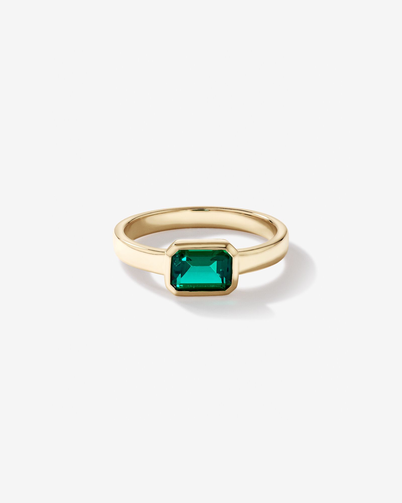 East-West Set Created Emerald Bezel Ring in 10kt Yellow Gold