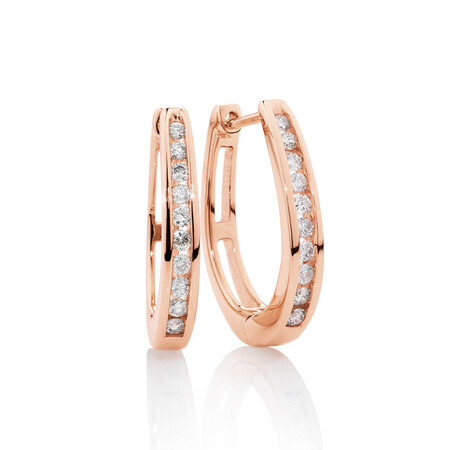 Huggie Earrings with 0.33 Carat TW of Diamonds in 10kt Rose Gold Huggie Earrings with 0.33 Carat TW of Diamonds in 10kt Rose Gold
