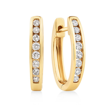 Huggie Earrings with 0.25 Carat TW of Diamonds in 10kt Yellow Gold