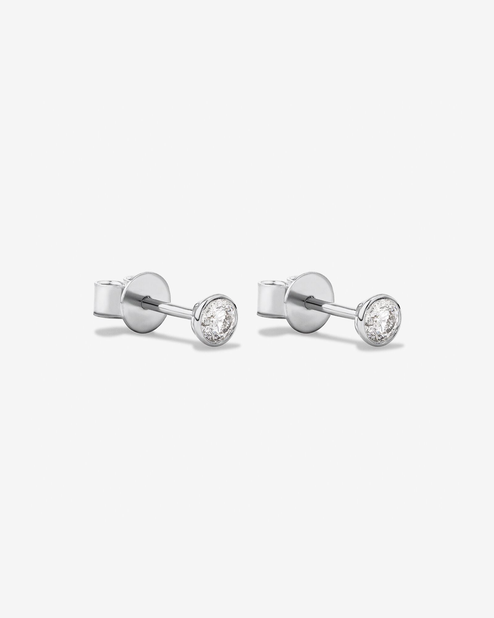 0.25 Carat TW Round Brilliant Diamond Solitaire Bezel Set Stud Earrings 18kt White Gold