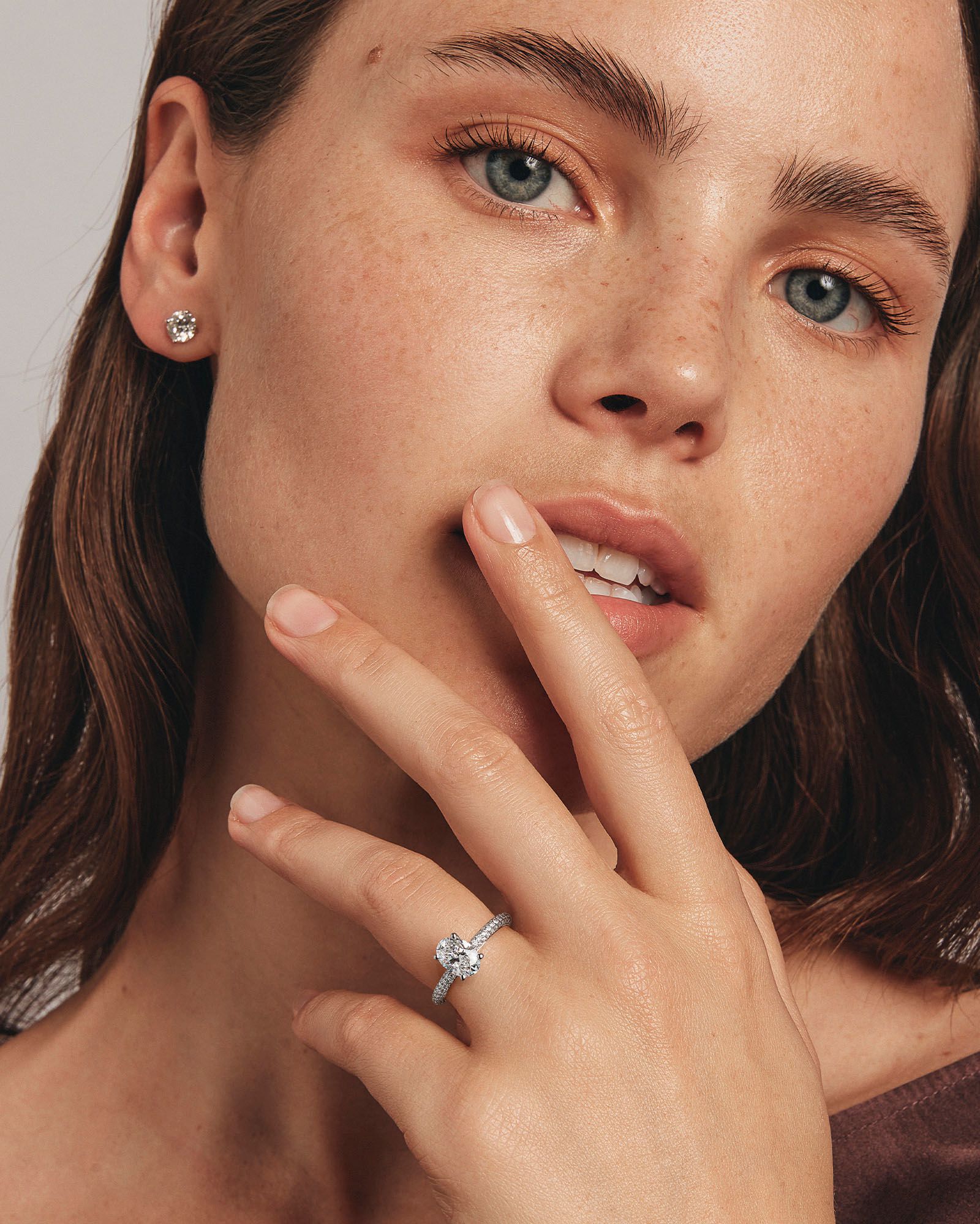 1.95 Carat TW Oval Cut Laboratory-Grown Diamond Solitaire Side Accent Engagement Ring in 14kt Gold