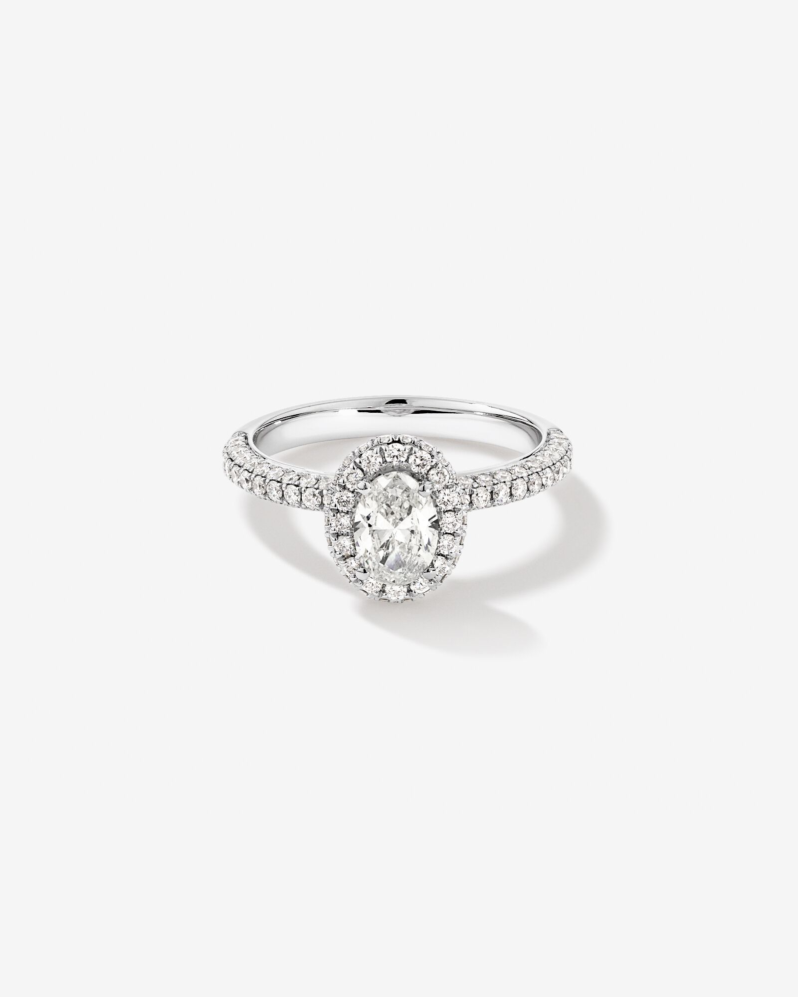 1.30 Carat TW Oval Cut Diamond Pave Halo Engagement Ring in Platinum