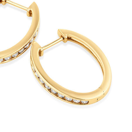 Huggie Earrings with 0.50 Carat TW of Diamonds in 10kt Yellow Gold Huggie Earrings with 0.50 Carat TW of Diamonds in 10kt Yellow Gold