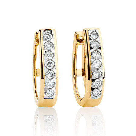 Huggie Earrings with 0.25 Carat TW of Diamonds in 10kt Yellow Gold Huggie Earrings with 0.25 Carat TW of Diamonds in 10kt Yellow Gold