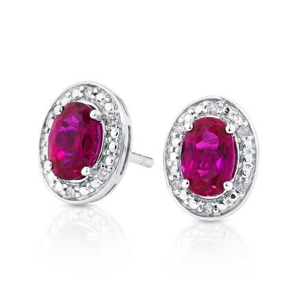 Halo Earrings with Created Ruby and 0.04 Carat TW of Diamonds in Sterling Silver Halo Earrings with Created Ruby and 0.04 Carat TW of Diamonds in Sterling Silver