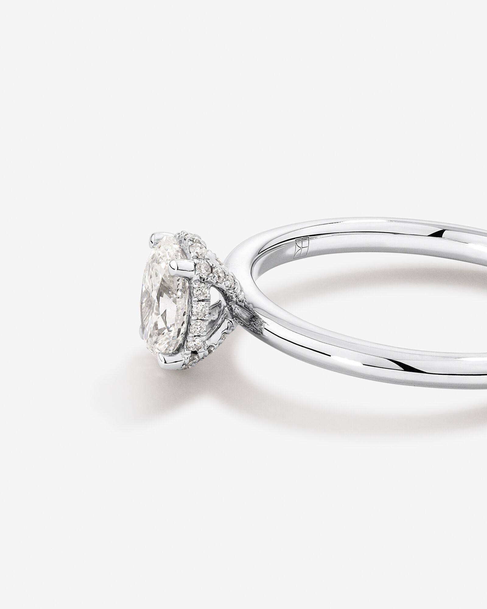 0.68 Carat TW Oval Cut Diamond Solitaire Pave Hidden Halo Engagement Ring in Platinum