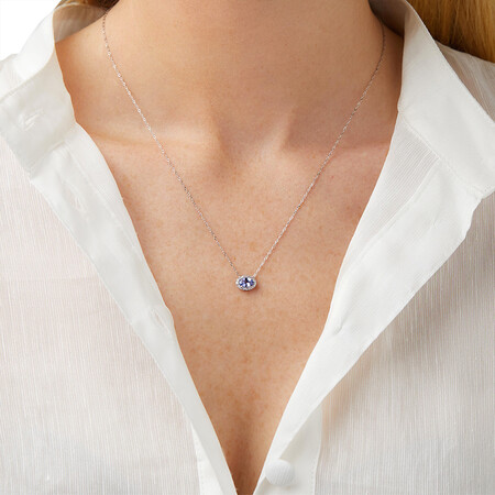 Halo Tanzanite & Diamond Necklace in 10kt White Gold Halo Tanzanite & Diamond Necklace in 10kt White Gold