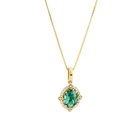 Halo Pendant With Created Emerald & Diamonds in 10kt Yellow Gold Halo Pendant With Created Emerald & Diamonds in 10kt Yellow Gold