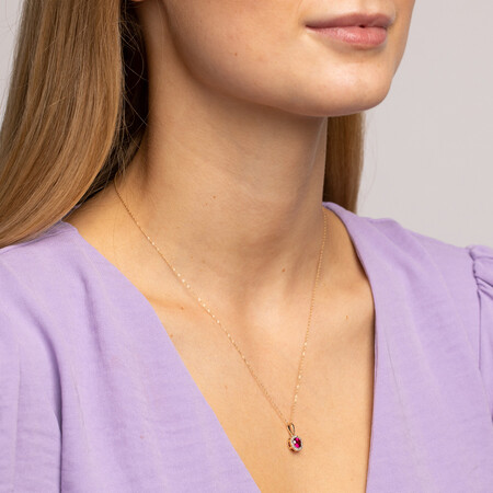 Halo Pendant with .09 Carat TW of Diamonds in 10kt Yellow Gold Halo Pendant with .09 Carat TW of Diamonds in 10kt Yellow Gold