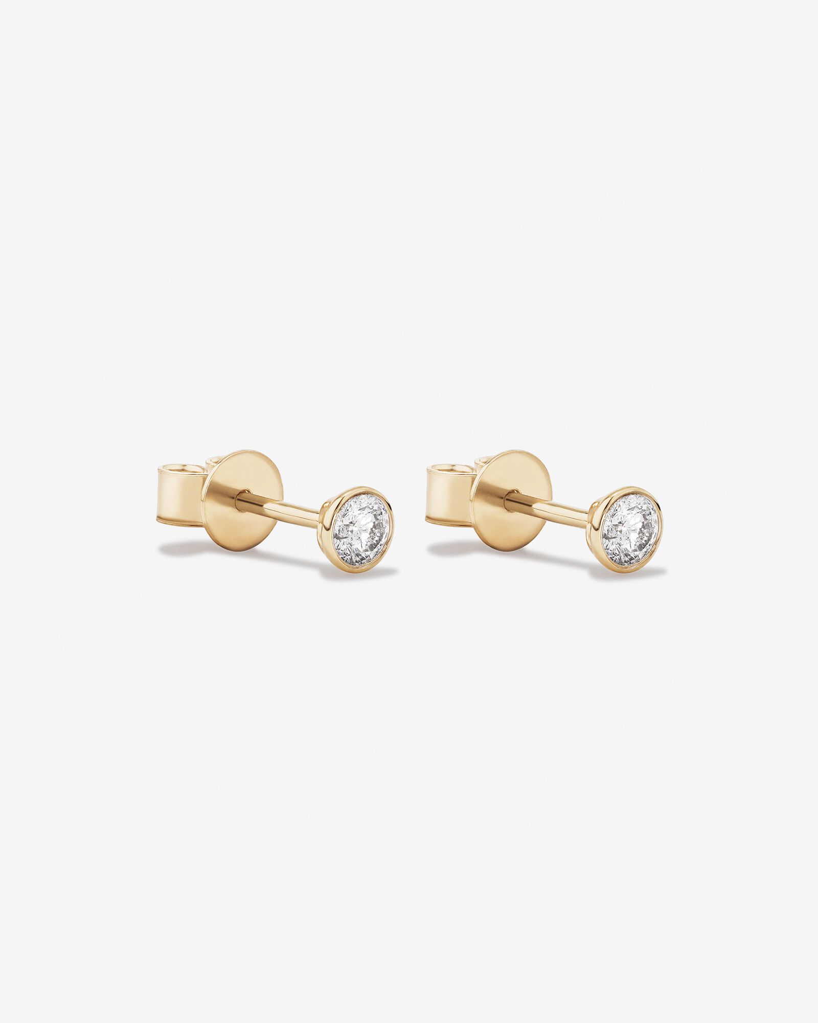0.25 Carat TW Round Brilliant Diamond Solitaire Bezel Set Stud Earrings 18kt Yellow Gold