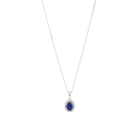 Halo Pendant with Created Blue Sapphire and 0.04 TW of Diamonds in Sterling Silver Halo Pendant with Created Blue Sapphire and 0.04 TW of Diamonds in Sterling Silver