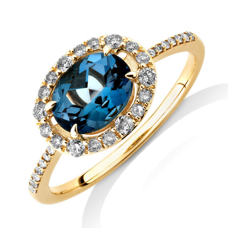 Halo Ring with London Blue Topaz & 0.25 Carat TW of Diamonds in 10kt Yellow Gold Halo Ring with London Blue Topaz & 0.25 Carat TW of Diamonds in 10kt Yellow Gold