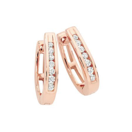 Huggie Earrings 0.15 Carat TW of Diamonds in 10kt Rose Gold Huggie Earrings 0.15 Carat TW of Diamonds in 10kt Rose Gold