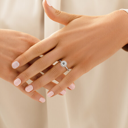 Halo Engagement Ring with 1.23 Carat TW of Diamonds. A 1 Carat Round Brilliant Laboratory-Created Centre Diamond and 0.23 Carat TW of Natural Diamonds in the Shoulders and Halo in 14kt White Gold Halo Engagement Ring with 1.23 Carat TW of Diamonds. A 1 Carat Round Brilliant Laboratory-Created Centre Diamond and 0.23 Carat TW of Natural Diamonds in the Shoulders and Halo in 14kt White Gold
