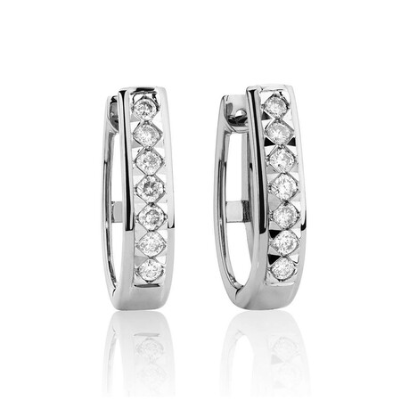 Huggie Earrings with 0.25 Carat TW of Diamonds in10kt White Gold Huggie Earrings with 0.25 Carat TW of Diamonds in10kt White Gold