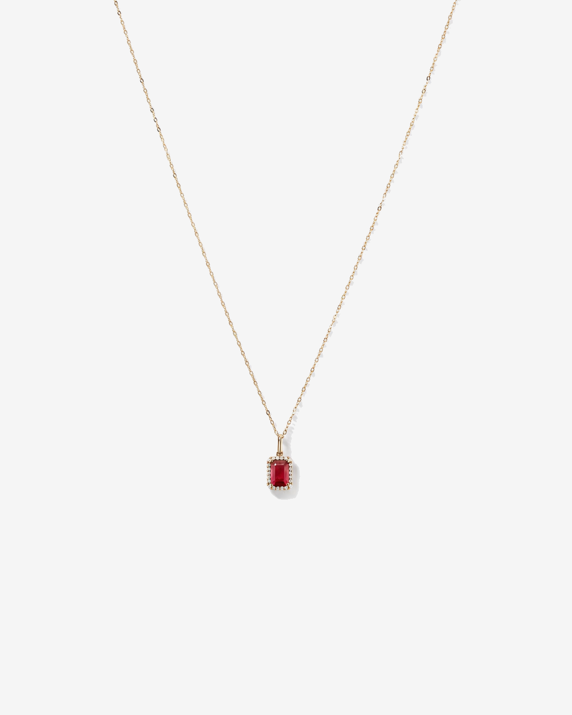 Emerald Cut Created Ruby and Diamond Halo Pendant with Chain in 10kt Yellow Gold
