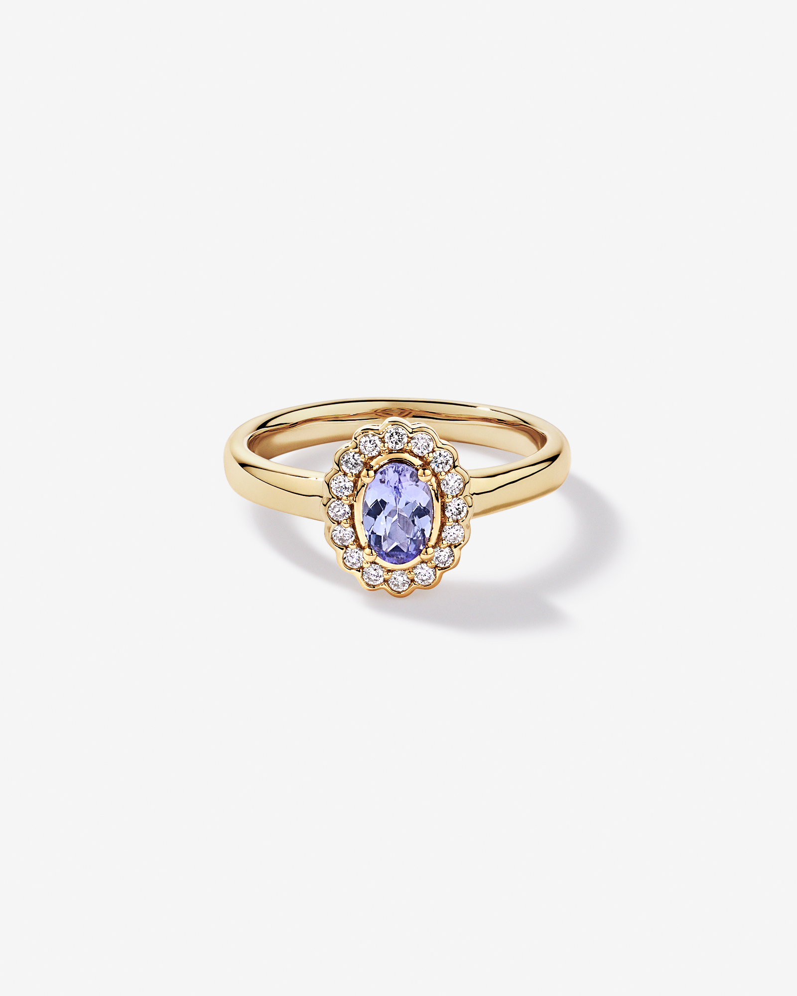 Tanzanite & 0.15TW of Diamond Halo Ring 10kt Yellow Gold