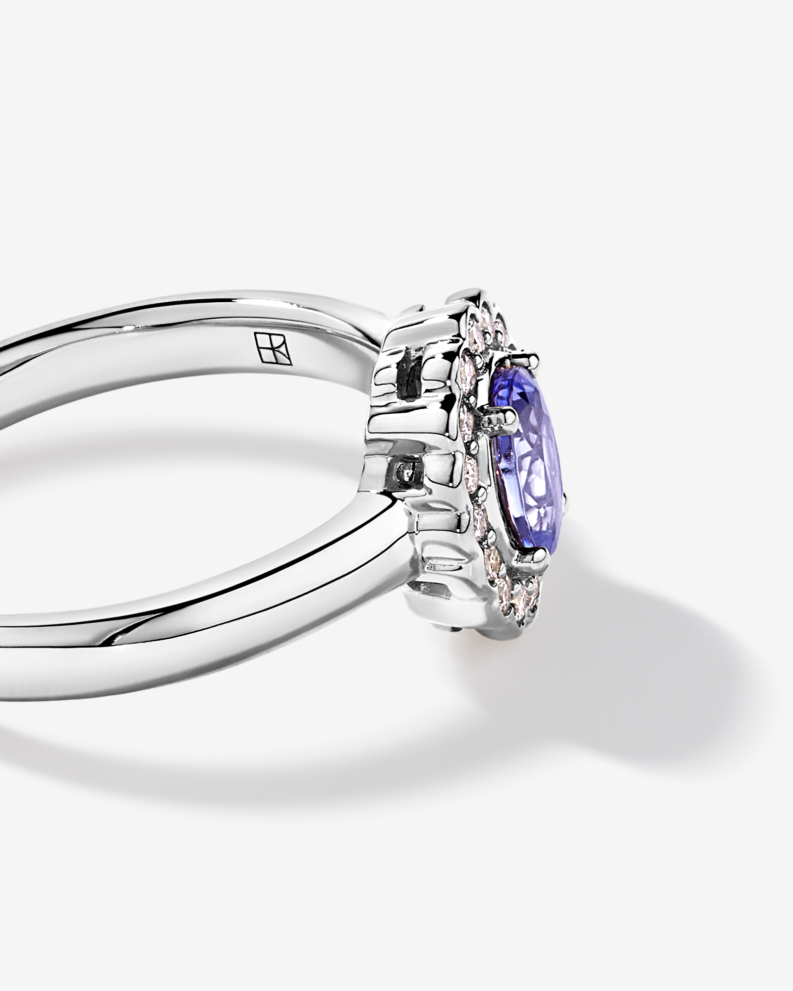 Tanzanite & 0.15TW of Diamond Halo Ring 10kt White Gold