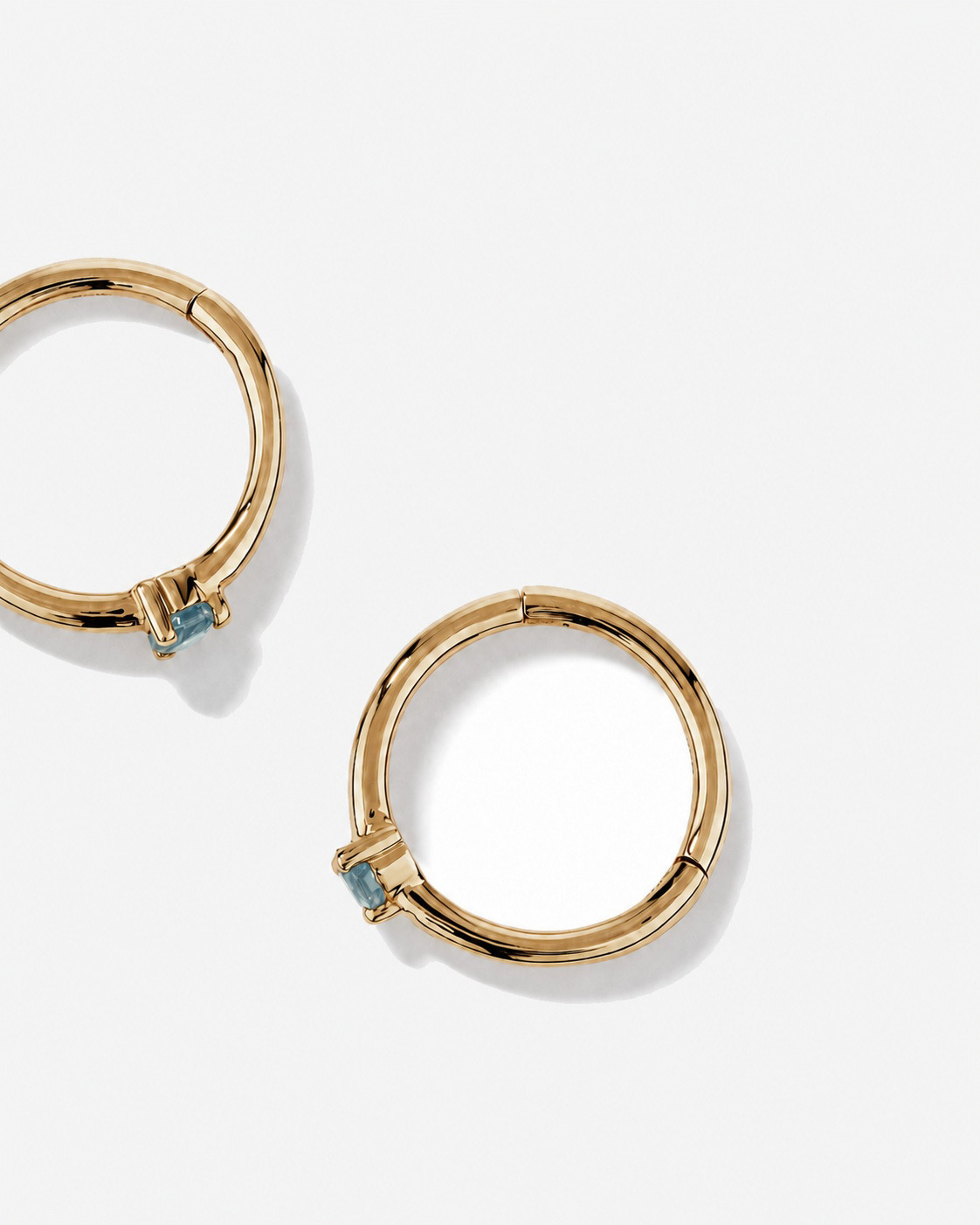 10mm Blue Topaz Accent Sleepers in 10kt Yellow Gold