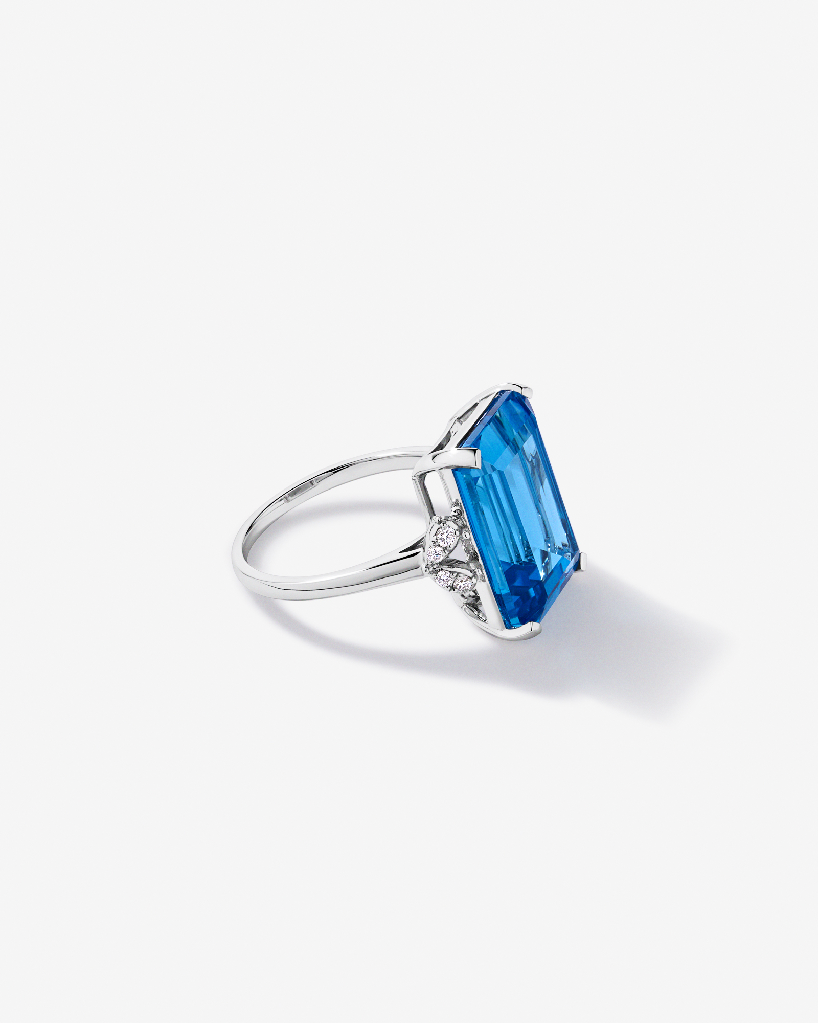 Emerald Cut Swiss Blue Topaz & 0.08 Carat TW Diamond Ring 10kt Gold