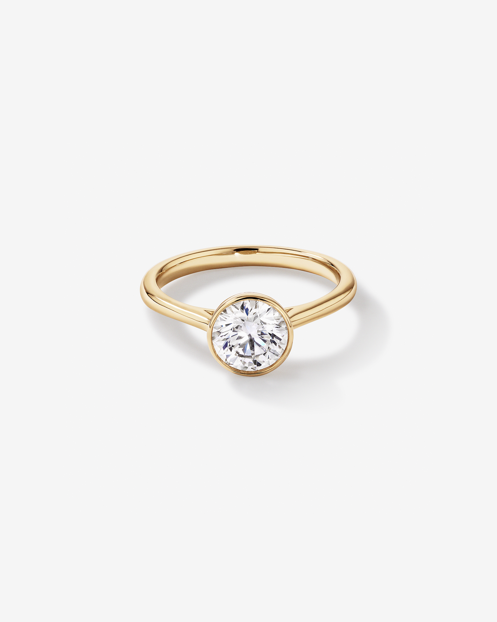 1.25 Carat TW Round Brilliant Laboratory-Grown Diamond Solitaire Bezel Set Engagement Ring 14kt Yellow Gold