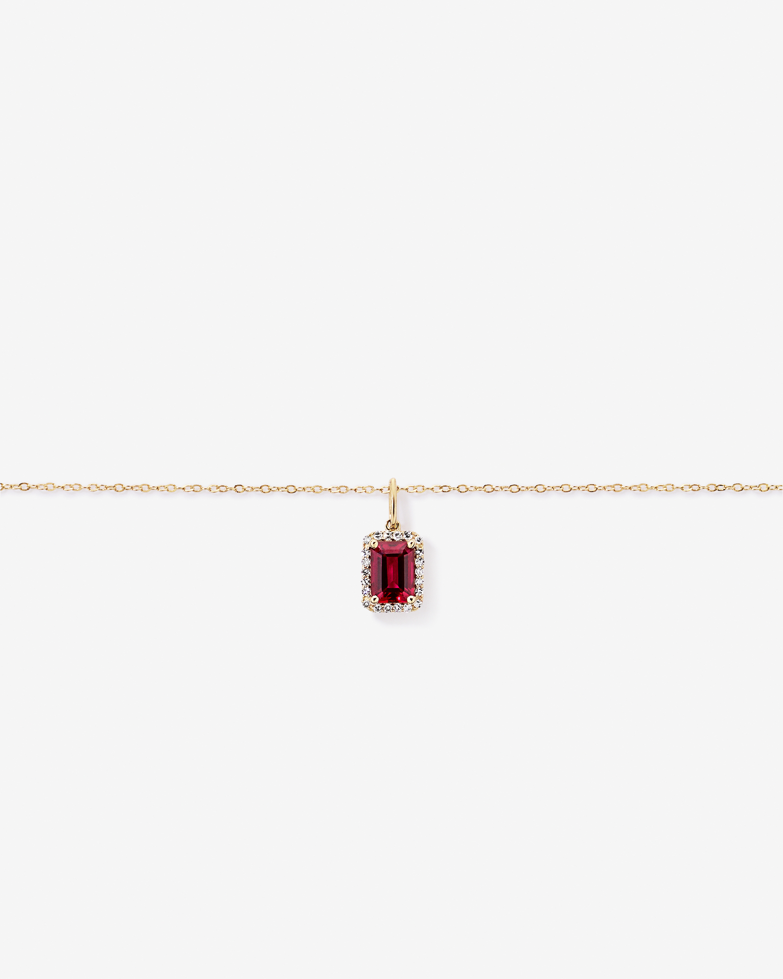 Emerald Cut Created Ruby and Diamond Halo Pendant with Chain in 10kt Yellow Gold