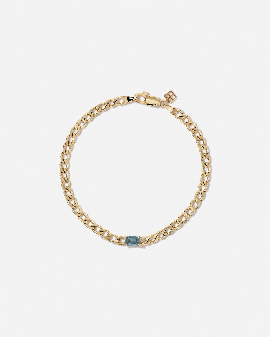 Bracelet gourmette Topaze bleue en or jaune 10 ct