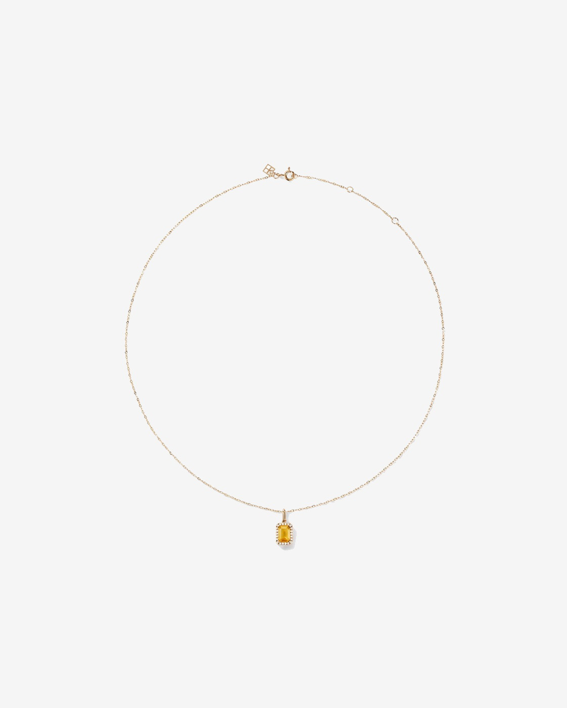 Pendentif avec chaîne en or jaune 10 carats : citrine taille émeraude et halo de diamants