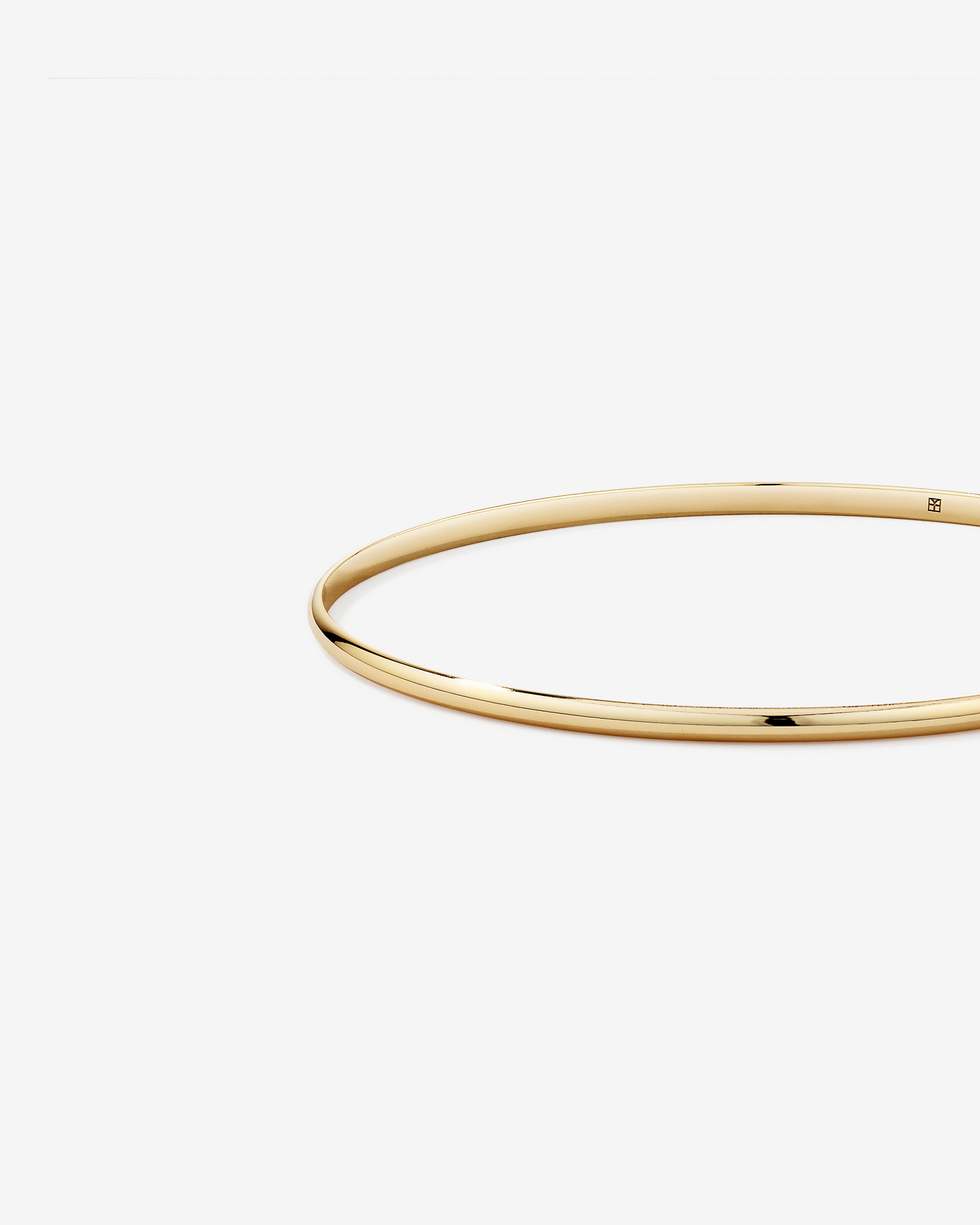 65mm (2.5") 2.3mm Width Solid Oval Bangle in 10kt Yellow Gold