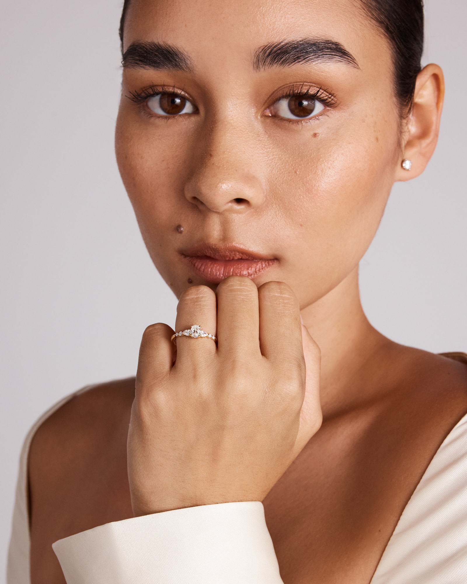 0.59 Carat TW Oval and Pear Sidestone Engagement Ring in 14kt Yellow Gold