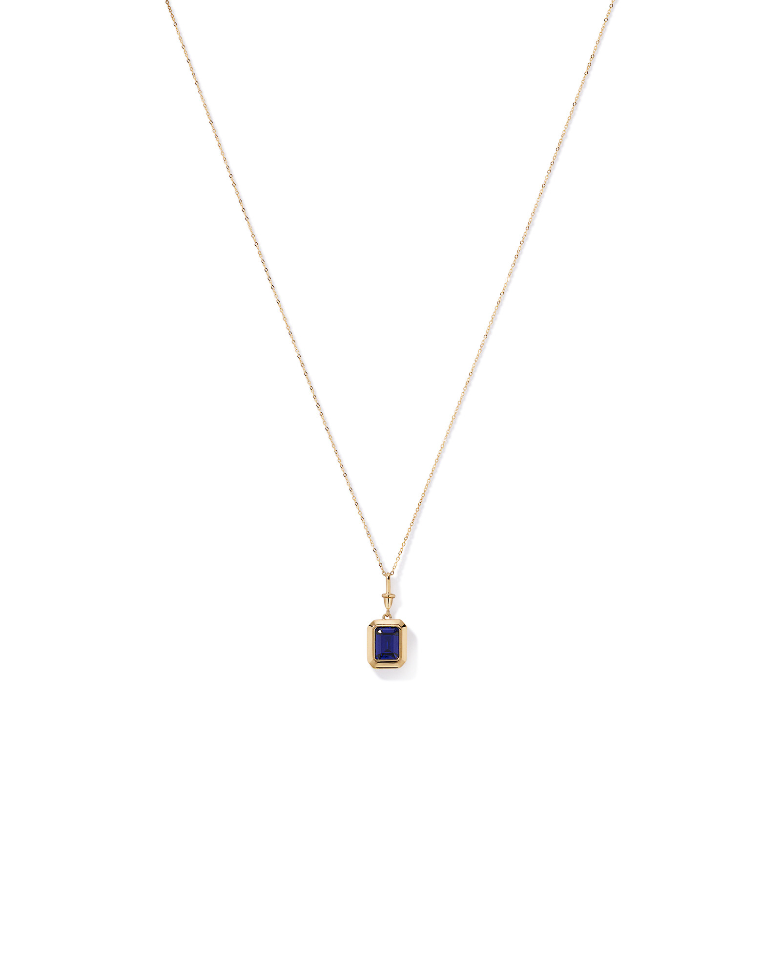 Emerald Cut Created Sapphire Bezel Pendant with Chain in 10kt Yellow Gold