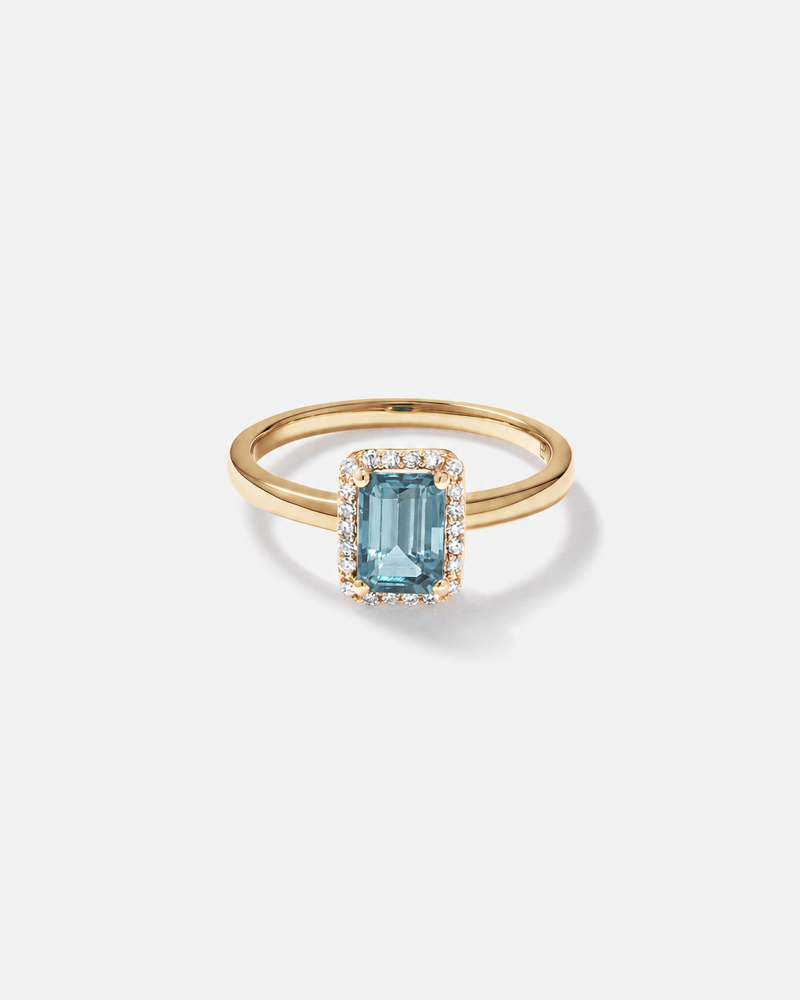 Emerald Cut Blue Topaz and Diamond Halo Ring in 10kt Yellow Gold