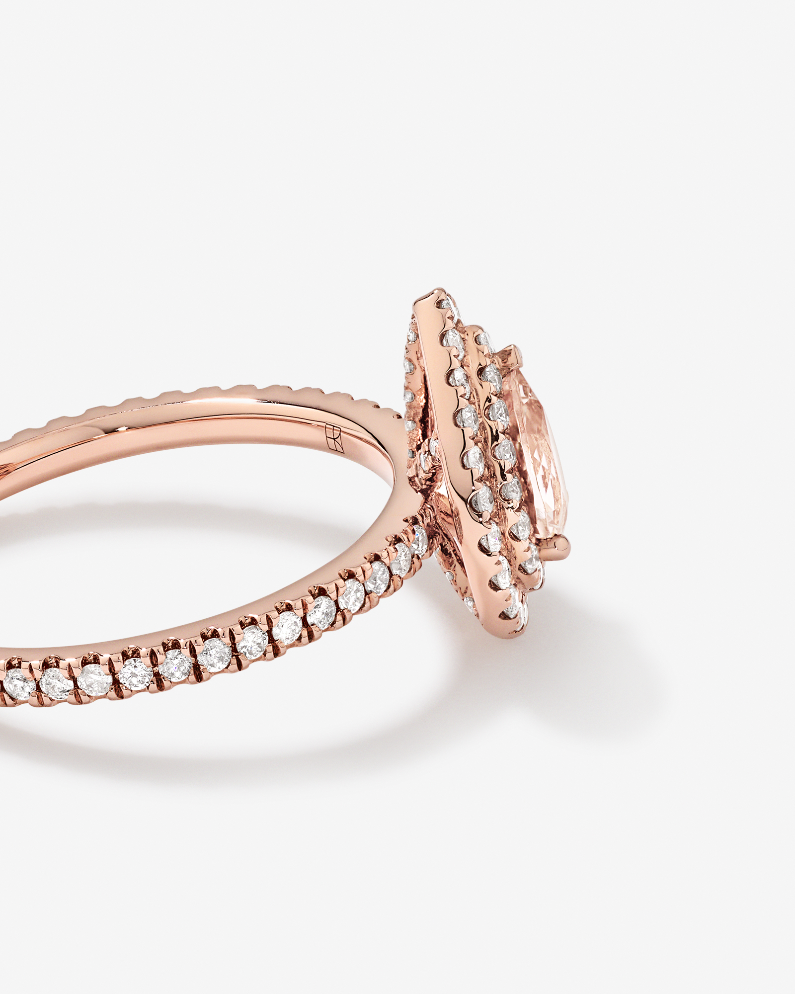 Pear Cut Morganite Gemstone and 0.45 Carat TW Diamond Halo and Side Accent Engagement Ring in 10kt Rose Gold