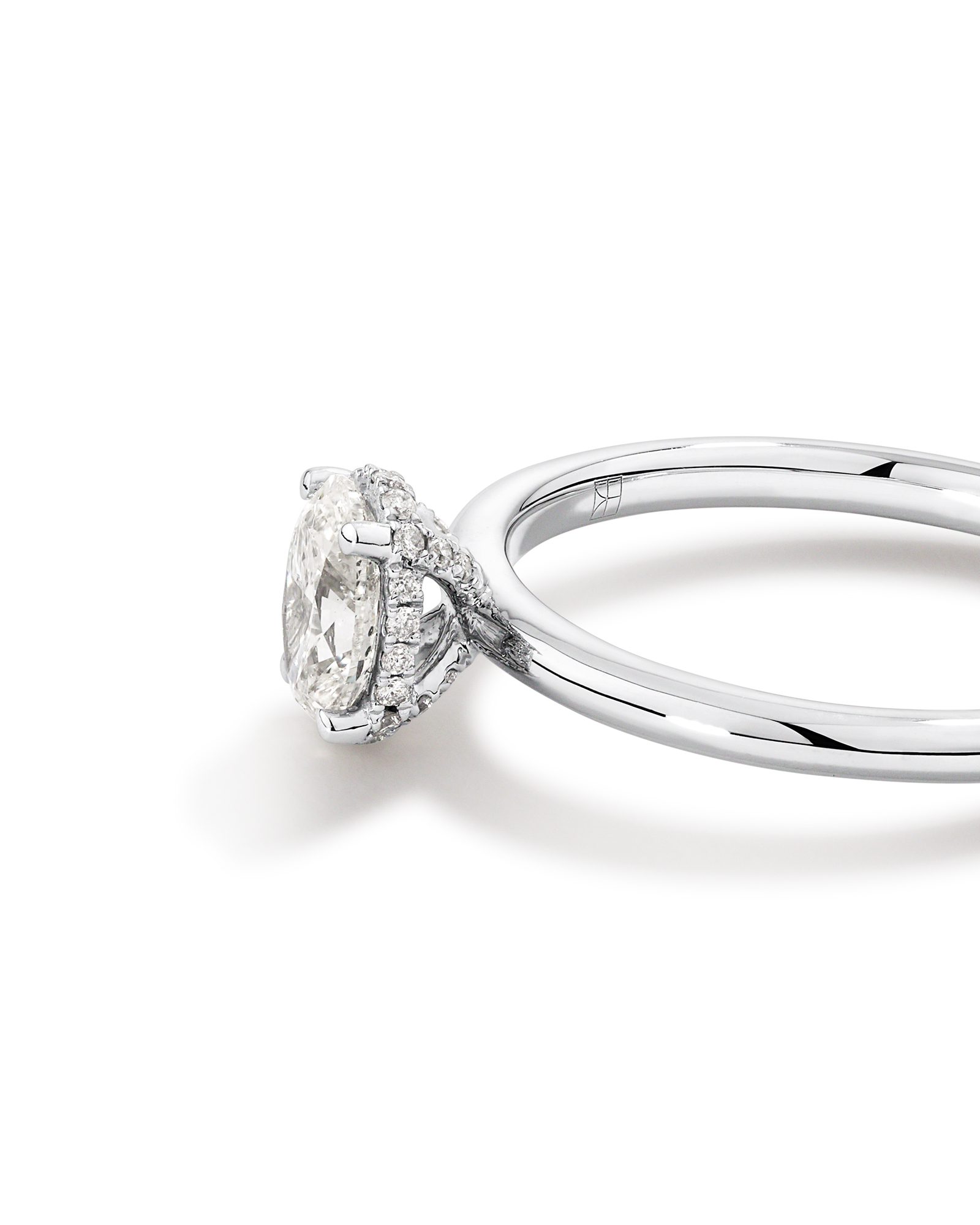 0.68 Carat TW Oval Cut Diamond Solitaire Hidden Pave Halo Engagement Ring in Platinum