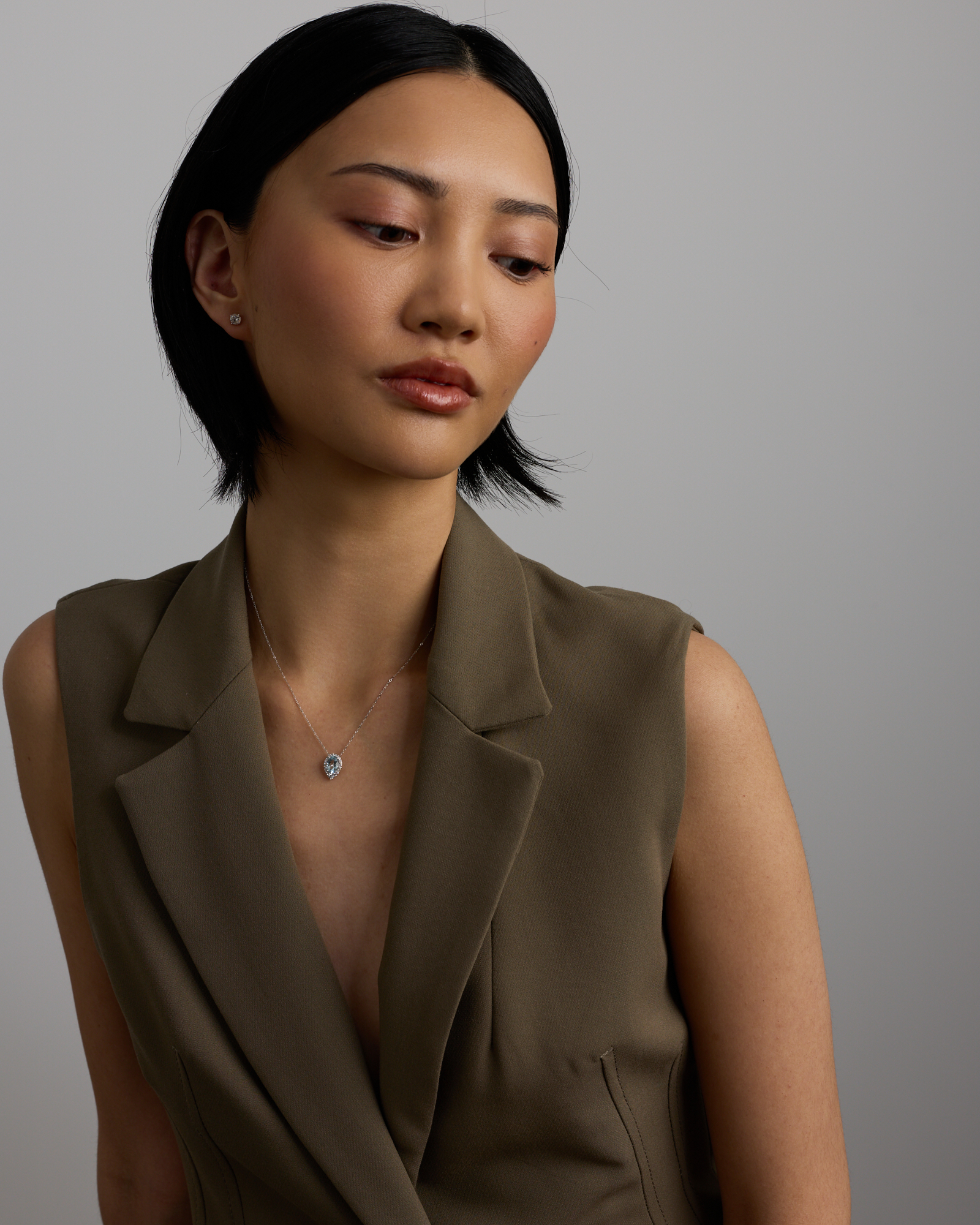 Oval Cut Blue Aquamarine Gemstone and 0.19 Carat TW Diamond Halo Pendant Necklace in 10kt White Gold