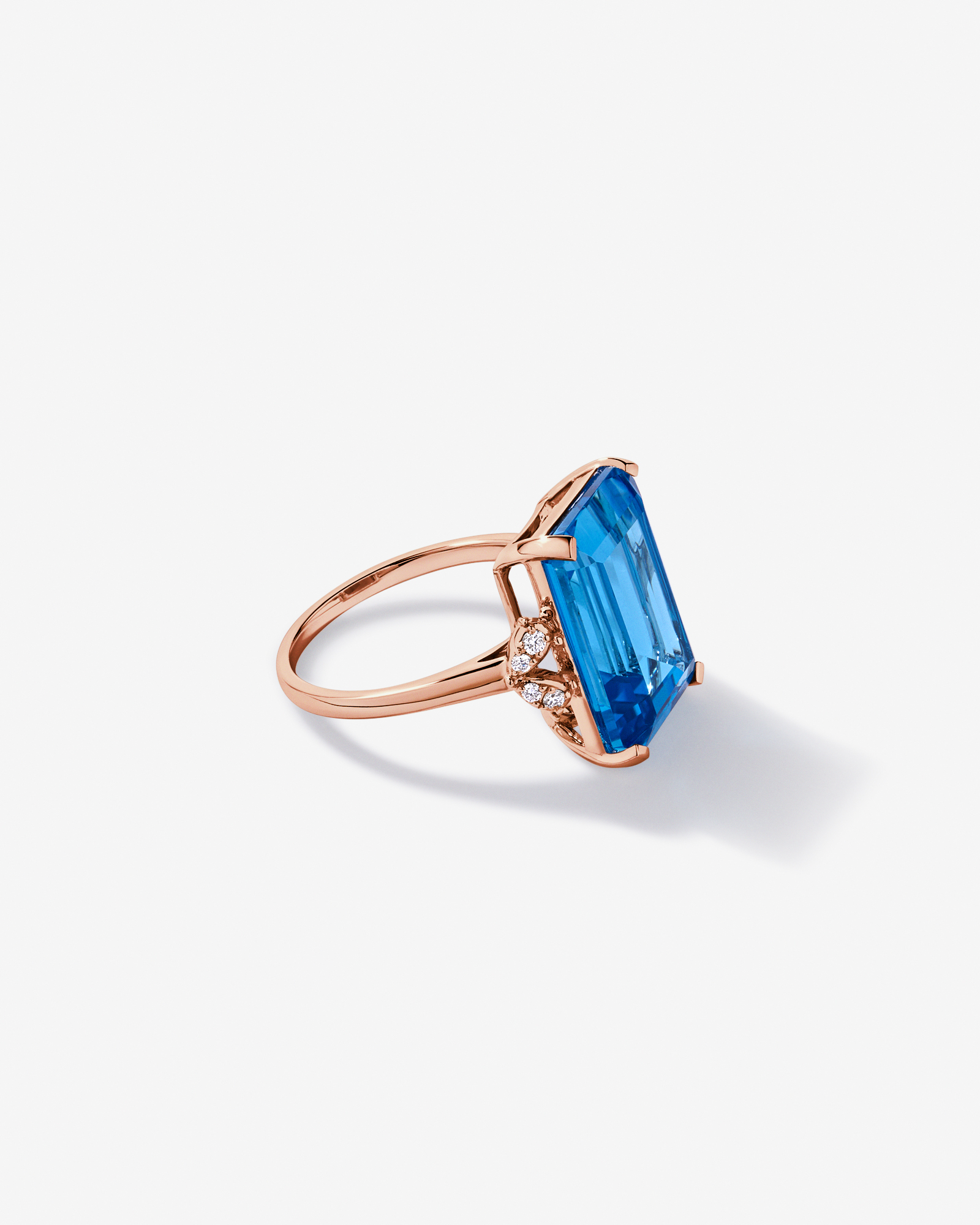 Emerald Cut Swiss Blue Topaz & 0.08 Carat TW Diamond Ring 10kt Rose Gold