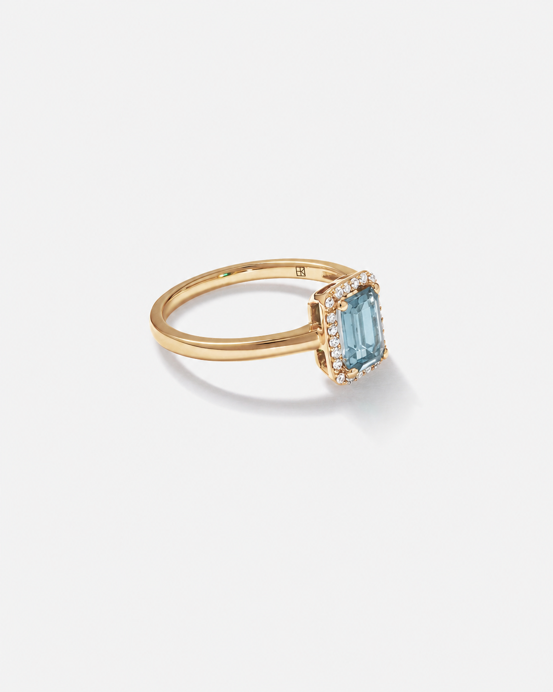 Emerald Cut Blue Topaz and Diamond Halo Ring in 10kt Yellow Gold