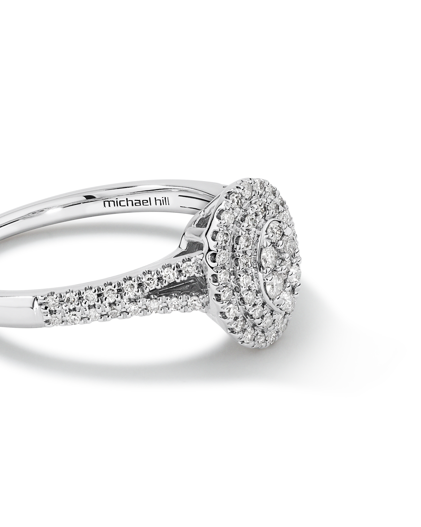 0.30 Carat TW Oval Shaped Cluster Halo Diamond Ring in 10kt White Gold