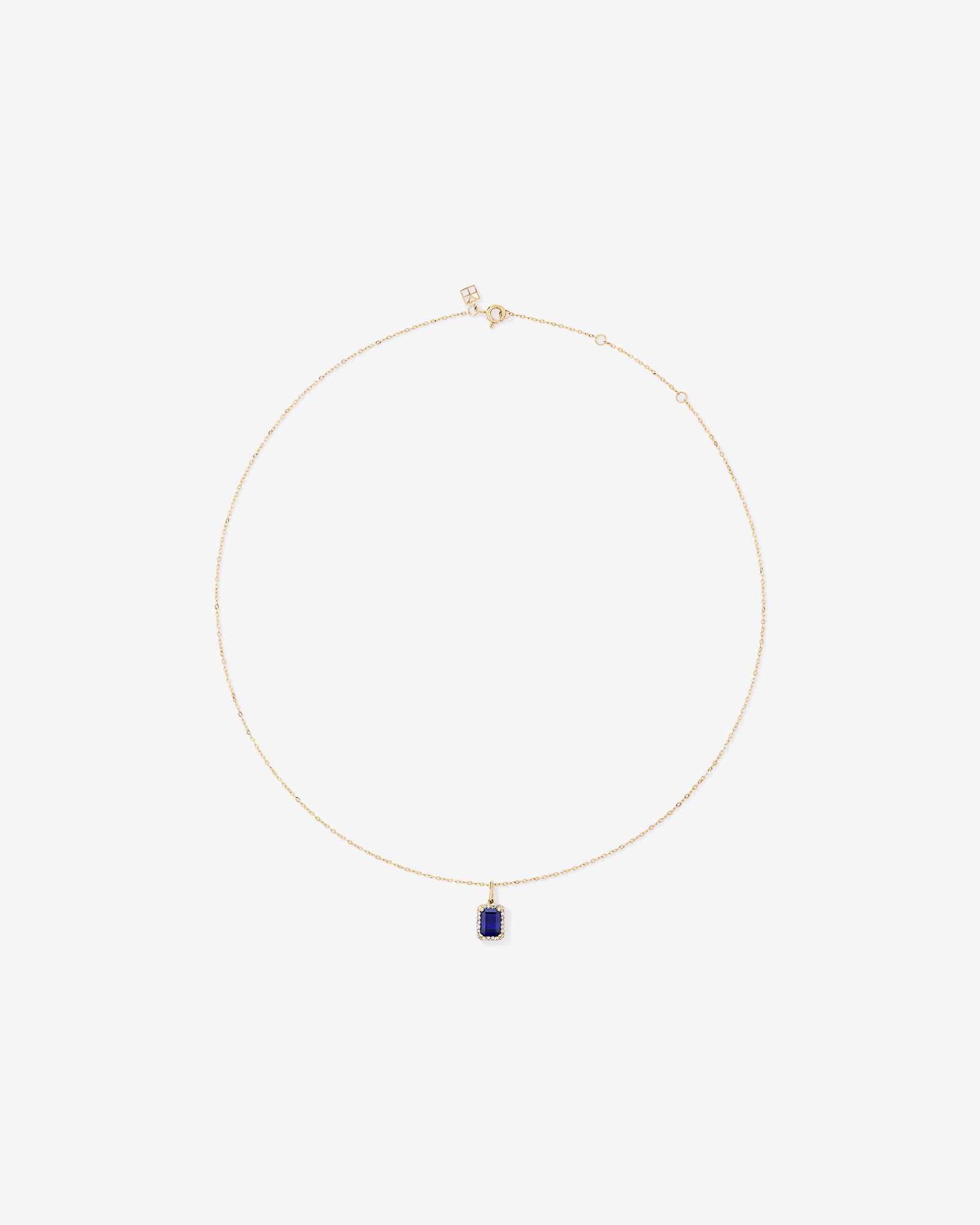 Emerald Cut Created Sapphire and Diamond Halo Pendant with Chain in 10kt Yellow Gold