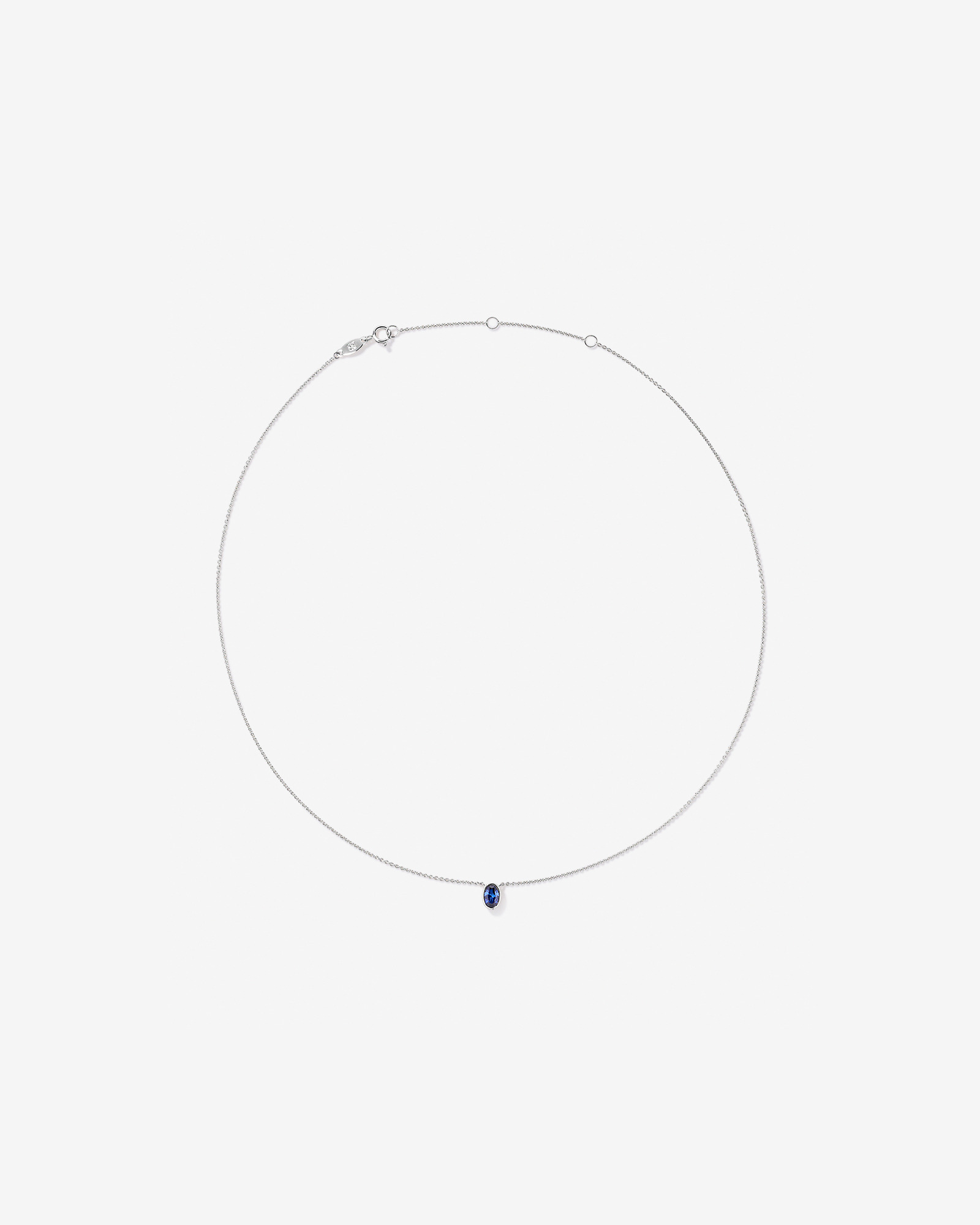 Oval Blue Created Sapphire Bezel Necklace in 10kt White Gold